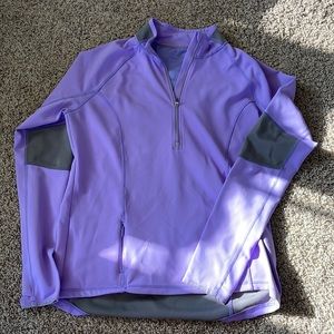 Athleta size L fitted light purple running jacket with reflectors.